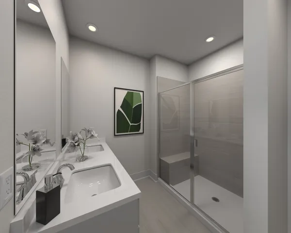 a bathroom with a sink a shower and a mirror
