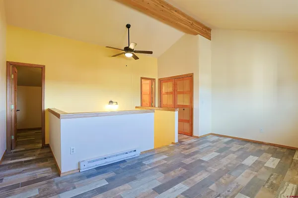 a view of room with wooden floor