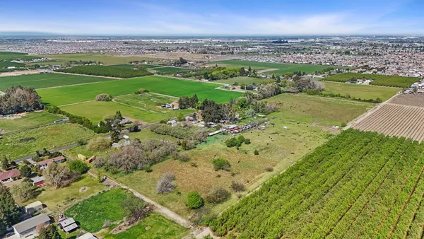 an aerial view of a houses with outdoor space