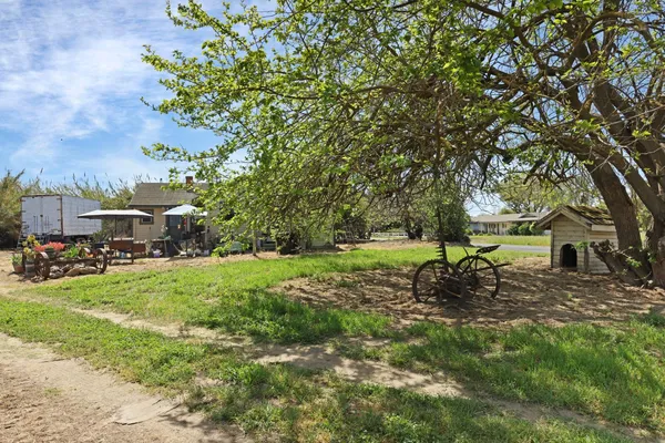 a view of a fire pit in front of a house