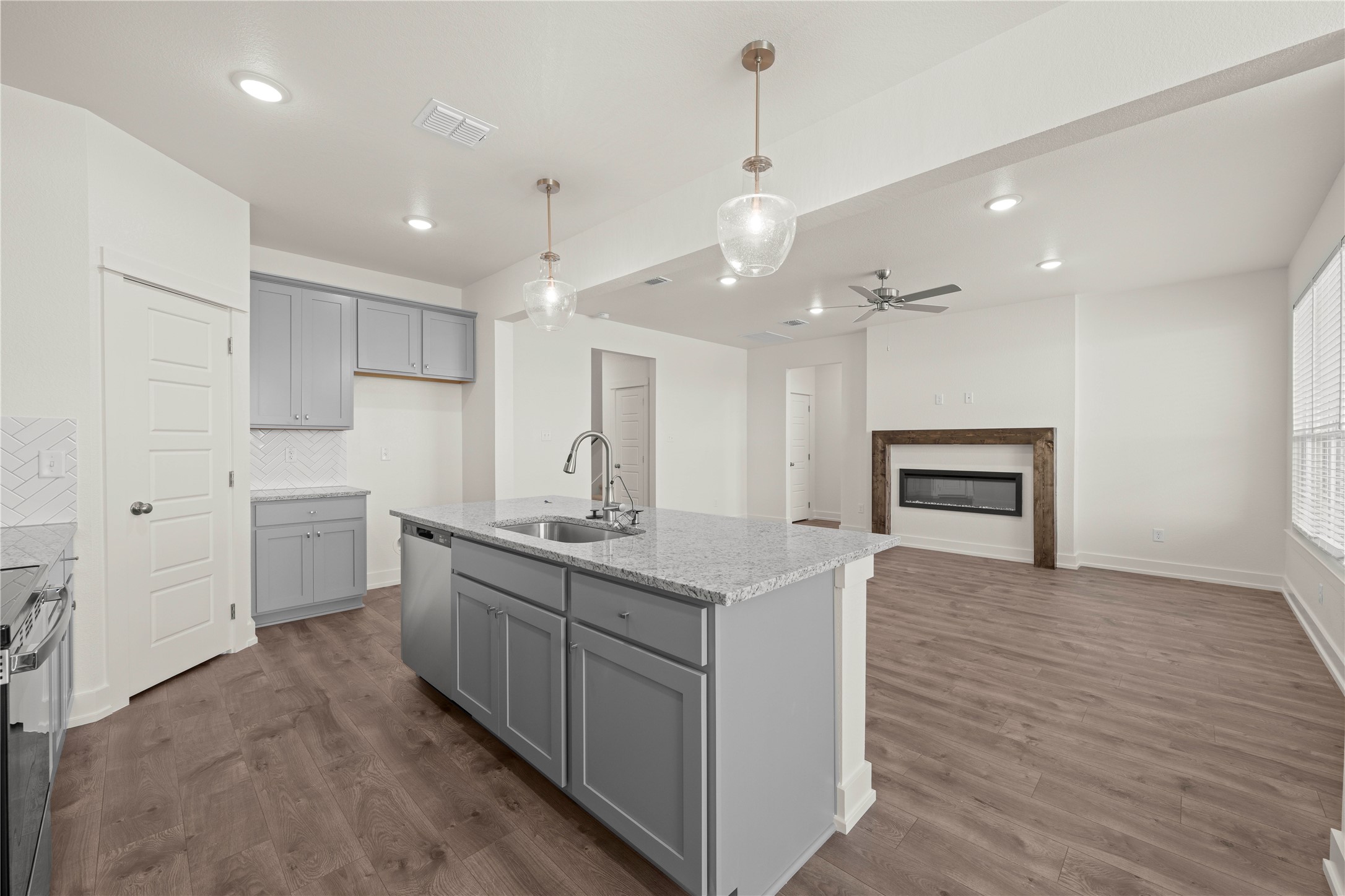 564 Gus Loop Georgetown, TX 78626 - Photo 5 of 32 a kitchen with sink stove and refrigerator