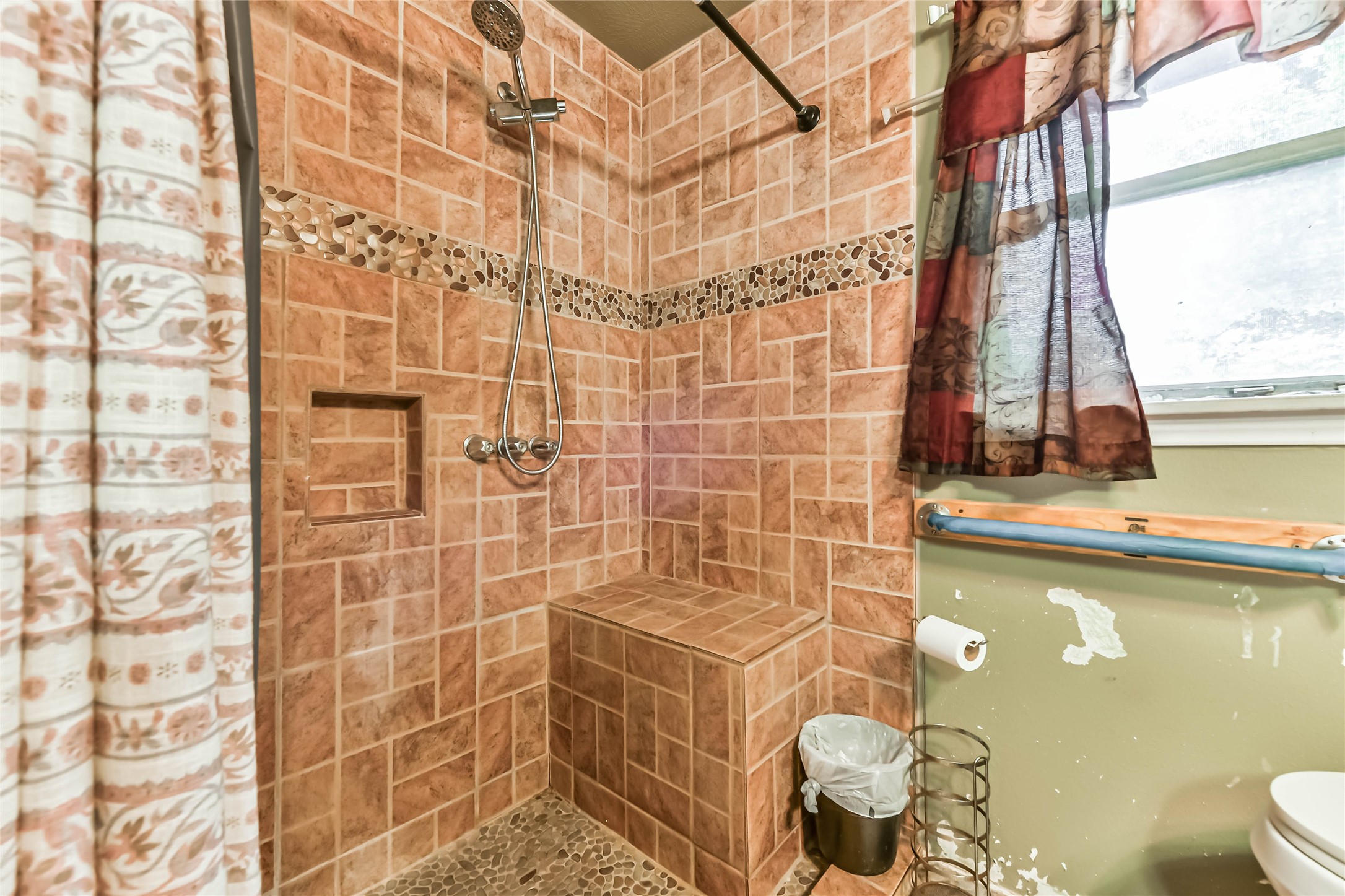 10438 Caxton Street Houston, TX 77016 - Photo 18 of 24 a bathroom with a sink a toilet and shower