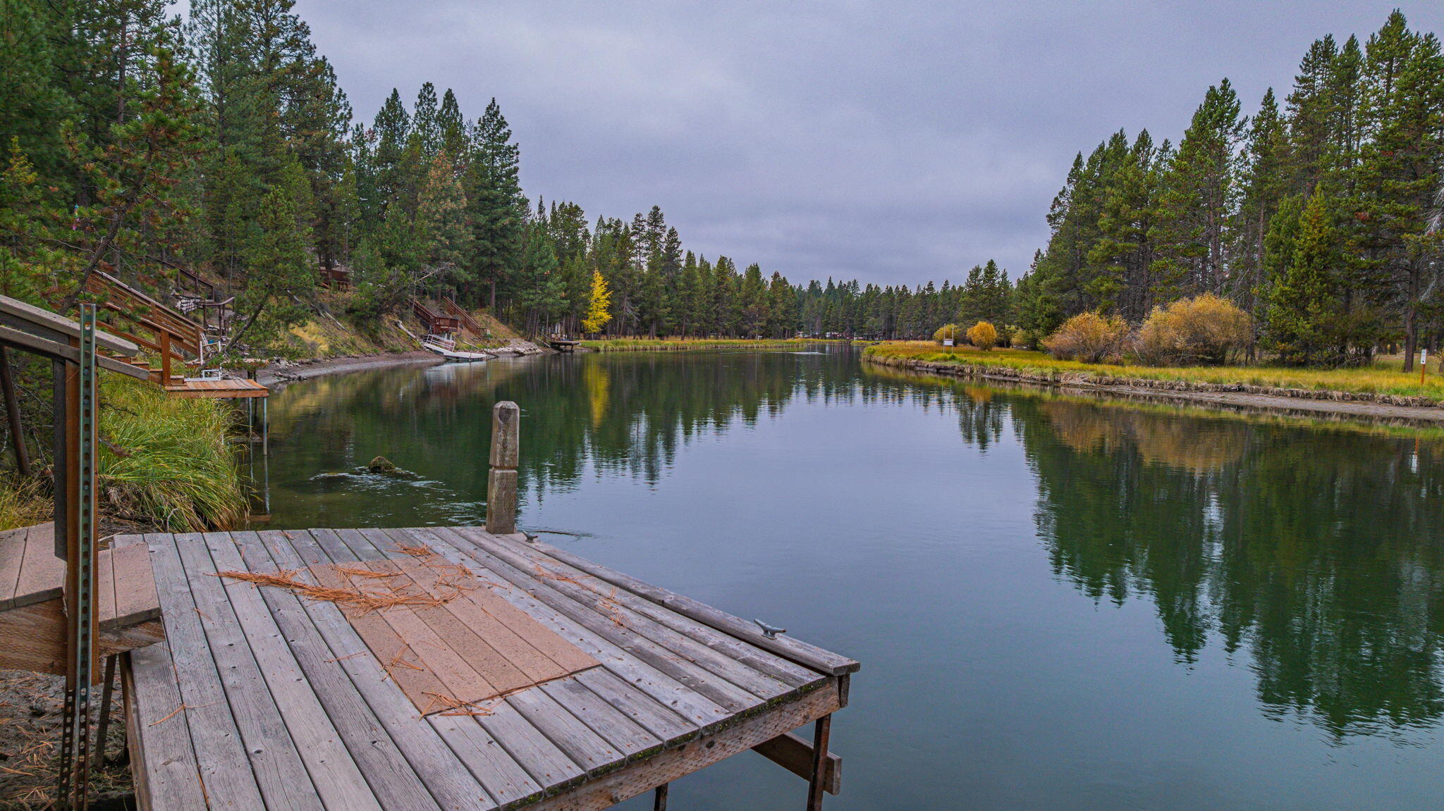 56019 Snow Goose Road Bend, OR 97707 - Photo 4 of 32 a wooden deck with lake view