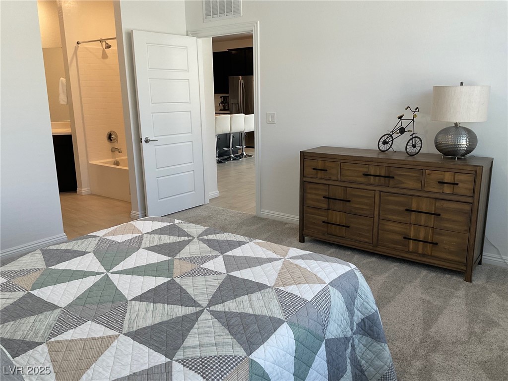 2555 Hampton Road, Unit 4209 Henderson, NV 89052 - Photo 30 of 67 Bedroom featuring ensuite bathroom and light carpet