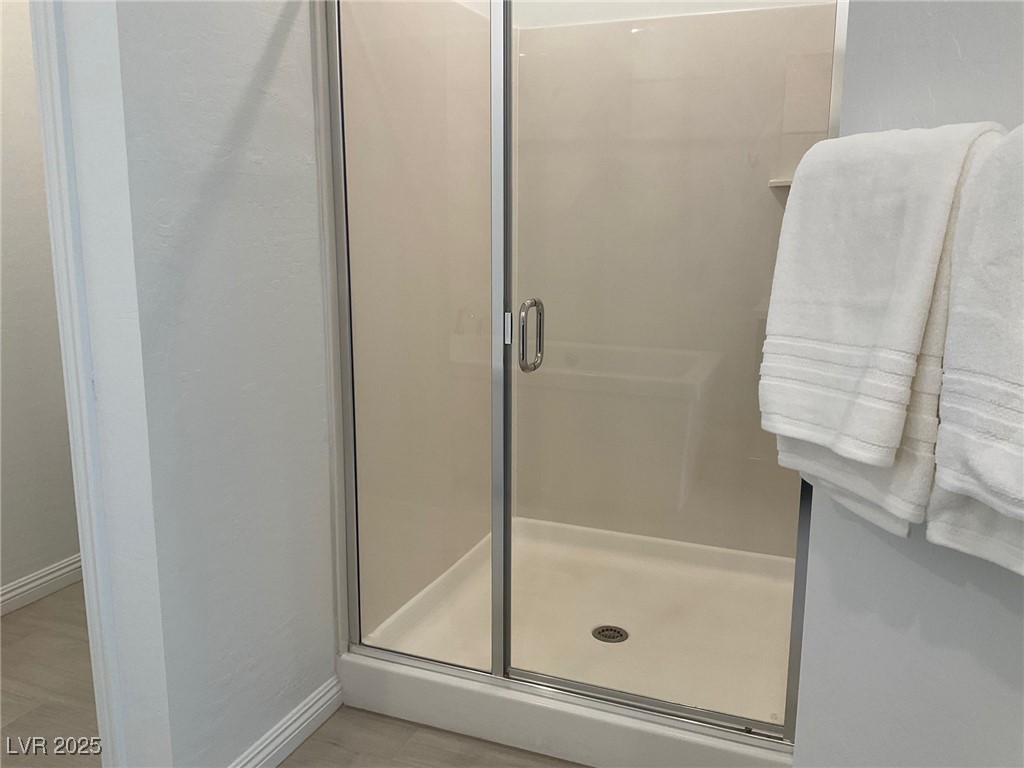 2555 Hampton Road, Unit 4209 Henderson, NV 89052 - Photo 45 of 67 Bathroom featuring a shower stall and baseboards