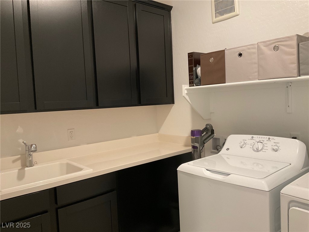 2555 Hampton Road, Unit 4209 Henderson, NV 89052 - Photo 52 of 67 Washroom with cabinet space and washer and dryer