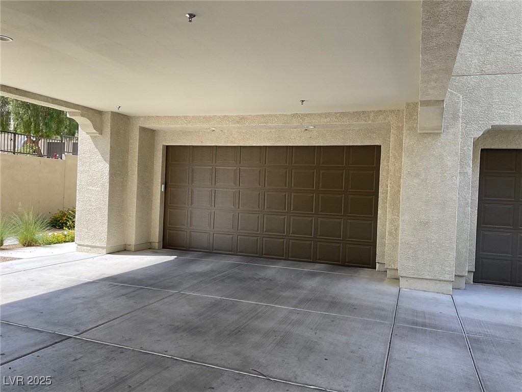 2555 Hampton Road, Unit 4209 Henderson, NV 89052 - Photo 66 of 67 Garage featuring concrete driveway