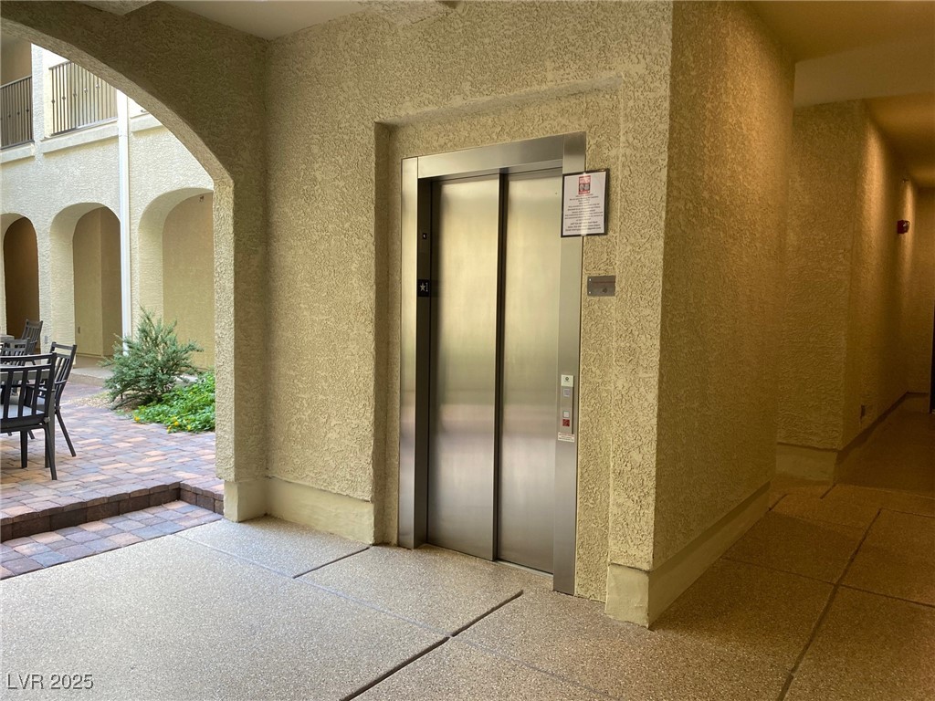 2555 Hampton Road, Unit 4209 Henderson, NV 89052 - Photo 7 of 67 Property entrance with a patio area, elevator, and stucco siding
