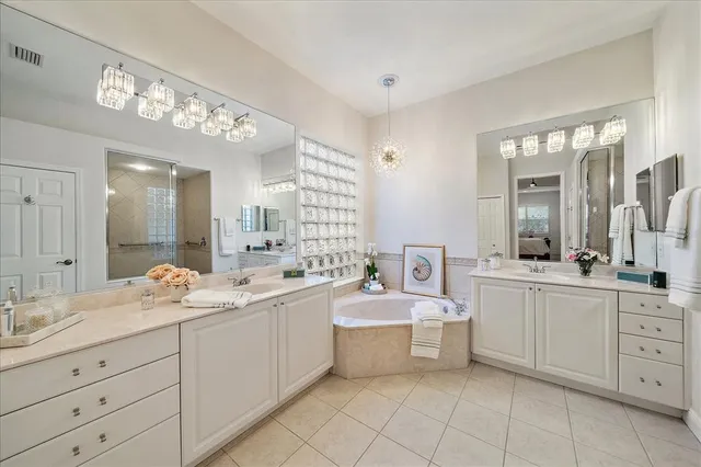 a bathroom with a sink a vanity and a mirror