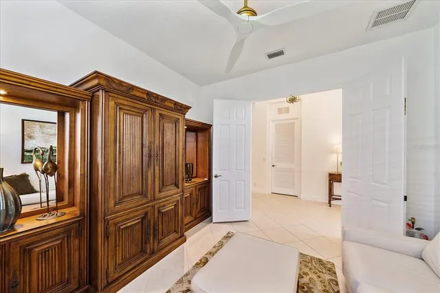 a bathroom with a double vanity sink a toilet and a mirror