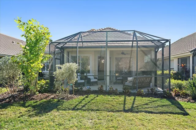 a view of a lake with houses in the back
