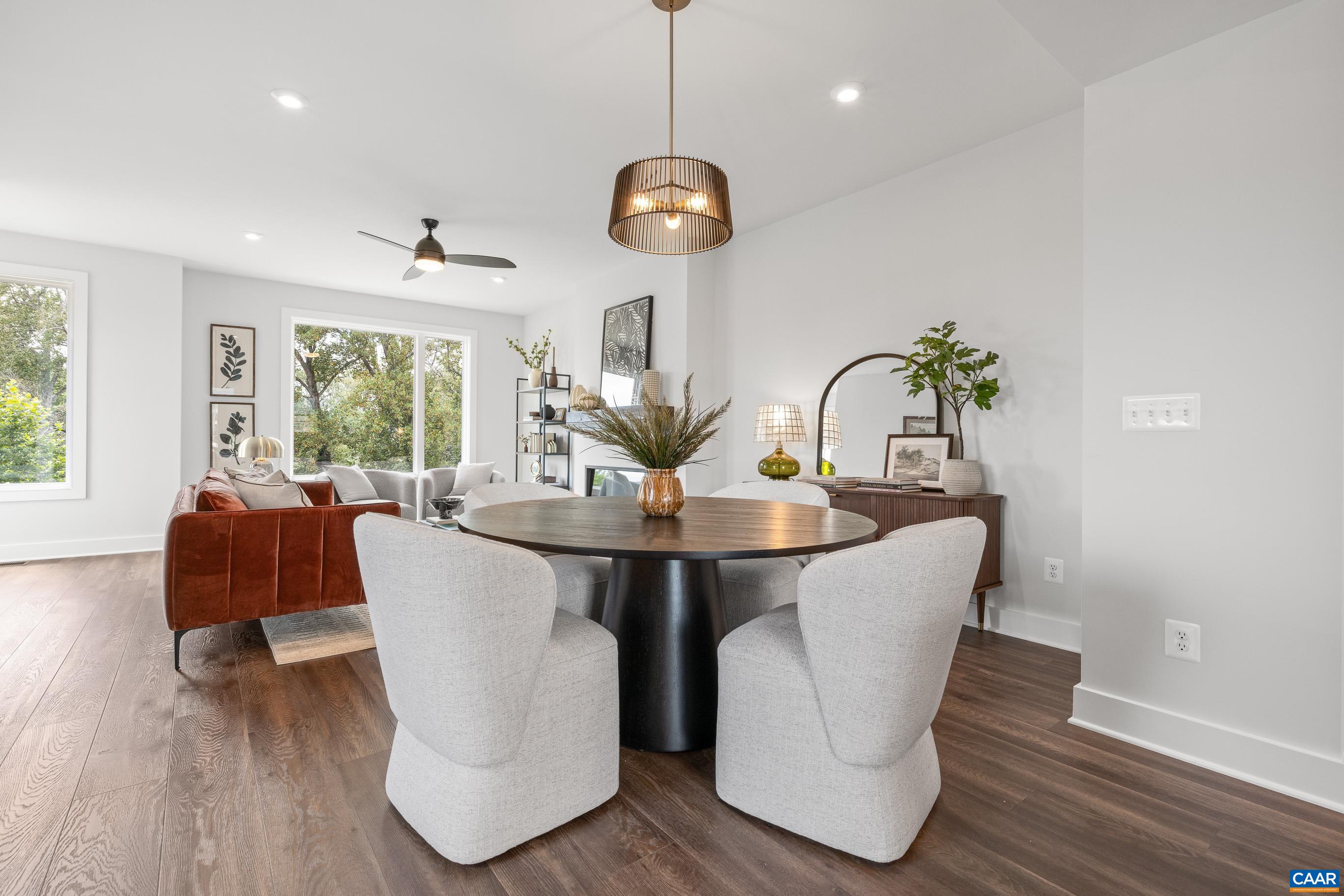 14 B Larkin Avenue Crozet, VA 22932 - Photo 12 of 40 a dining room with furniture a chandelier and wooden floor