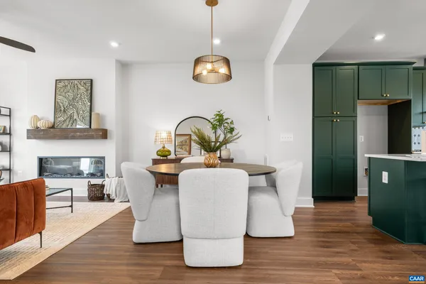a living room with dining table furniture and a window