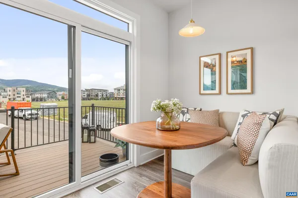 a view of a dining room with furniture window and outside view