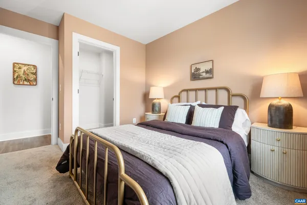 a bed room with a bed and a night stand