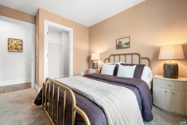 a bed room with a bed and a night stand