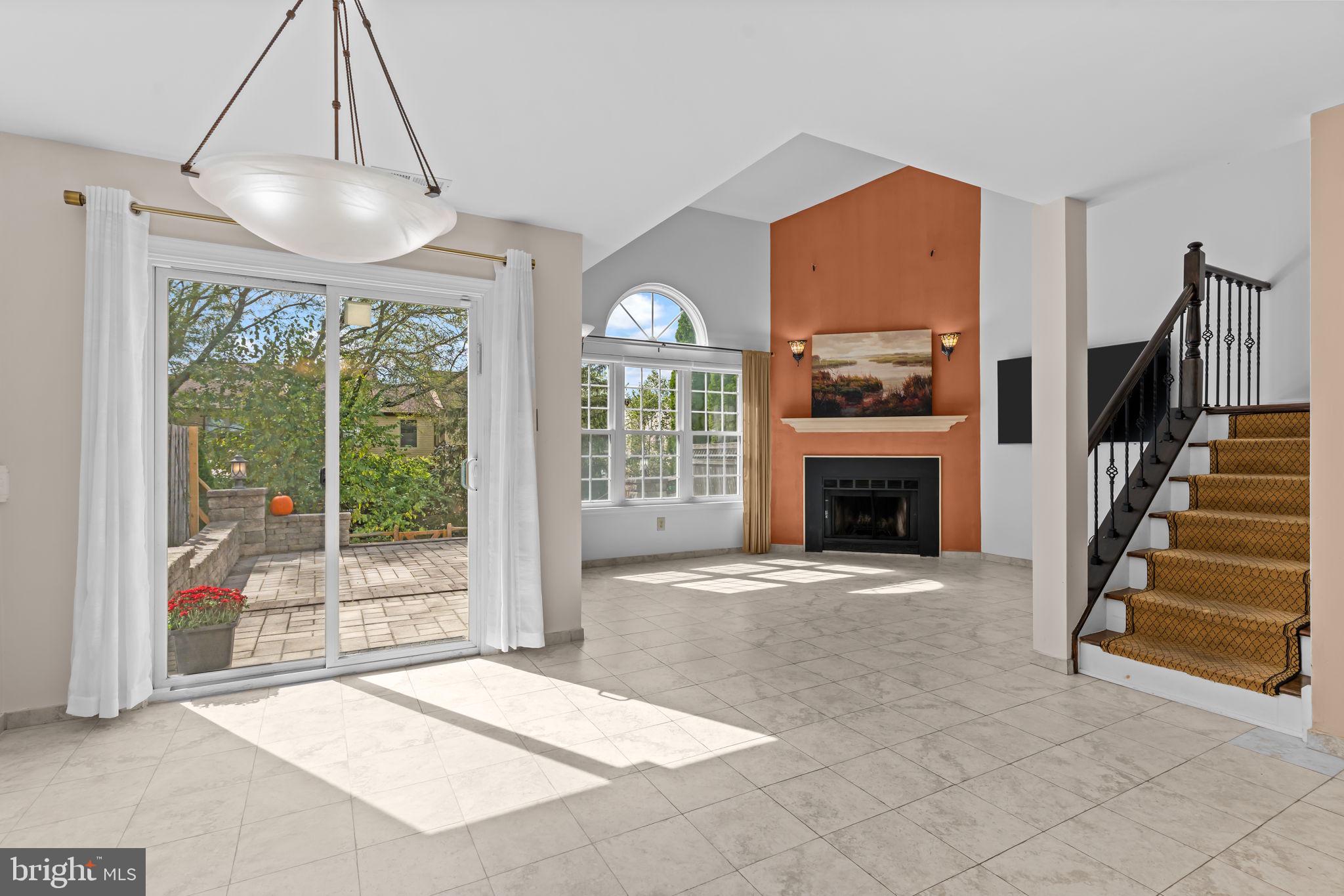 15 East Park Road Newtown, PA 18940 - Photo 13 of 35 a view of an empty room with a fireplace and a window