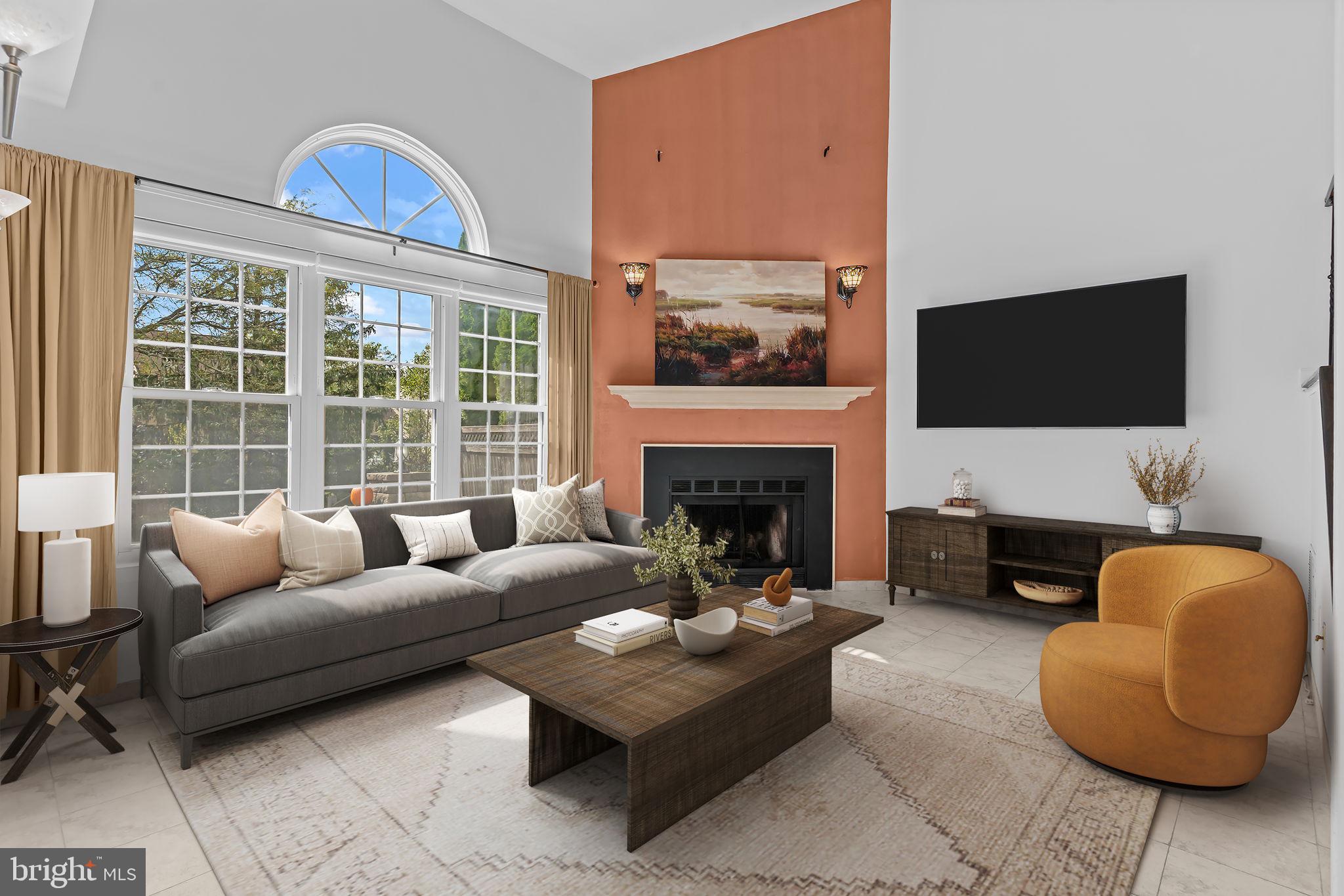 15 East Park Road Newtown, PA 18940 - Photo 14 of 35 a living room with furniture a flat screen tv and a fireplace