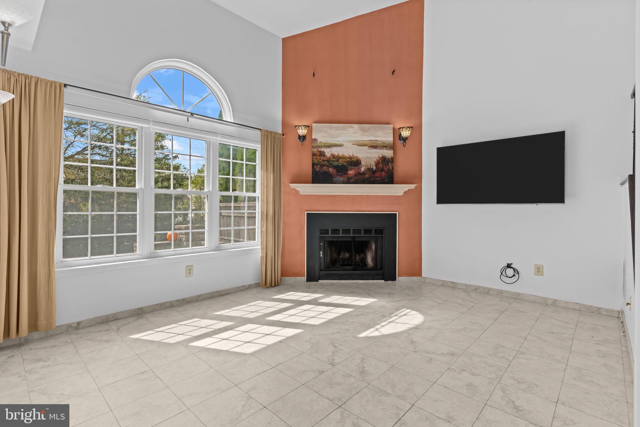 15 East Park Road Newtown, PA 18940 - Photo 15 of 35 a view of an empty room with a fireplace and a window