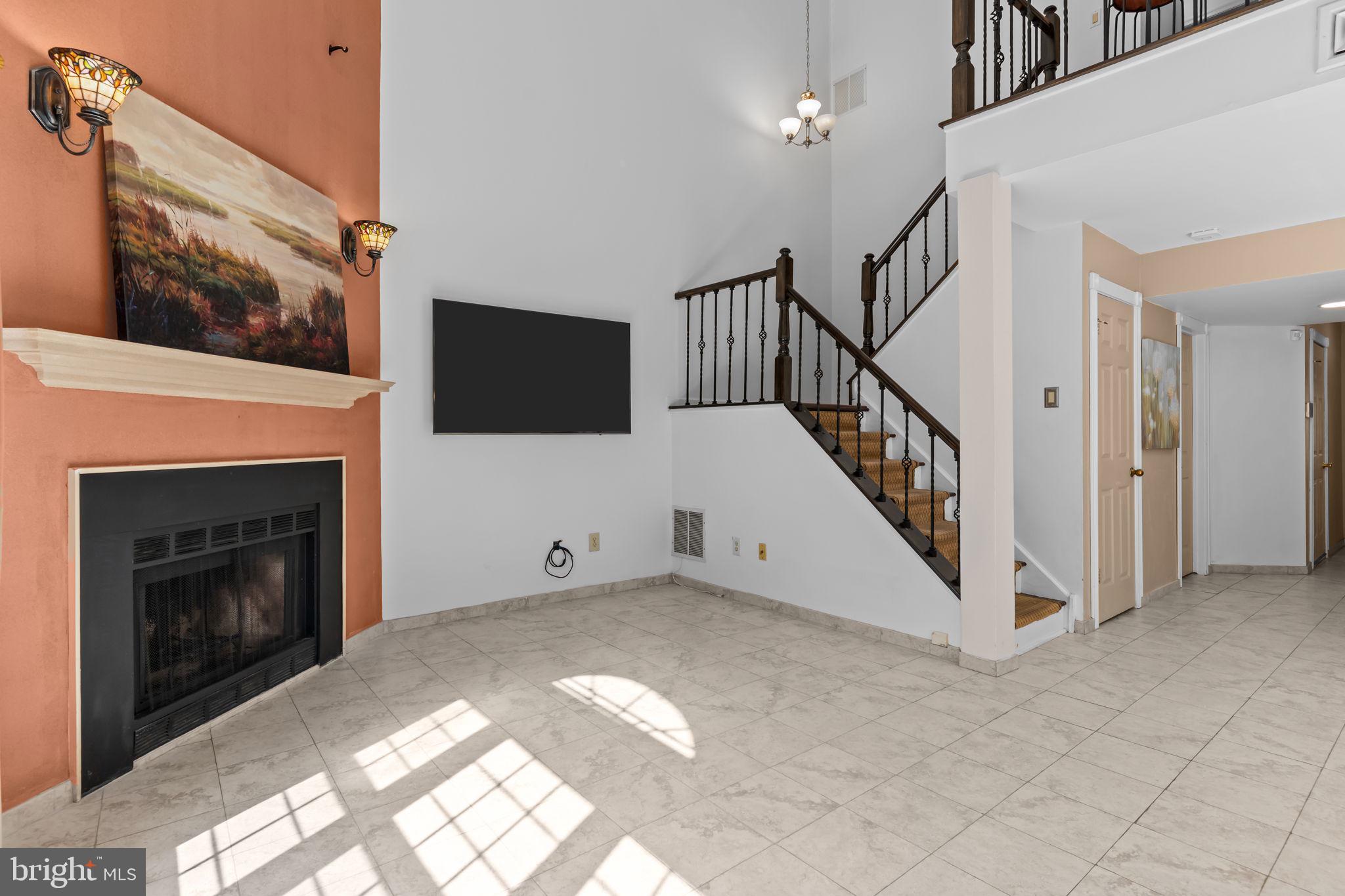 15 East Park Road Newtown, PA 18940 - Photo 16 of 35 a view of an empty room with a fireplace and a window