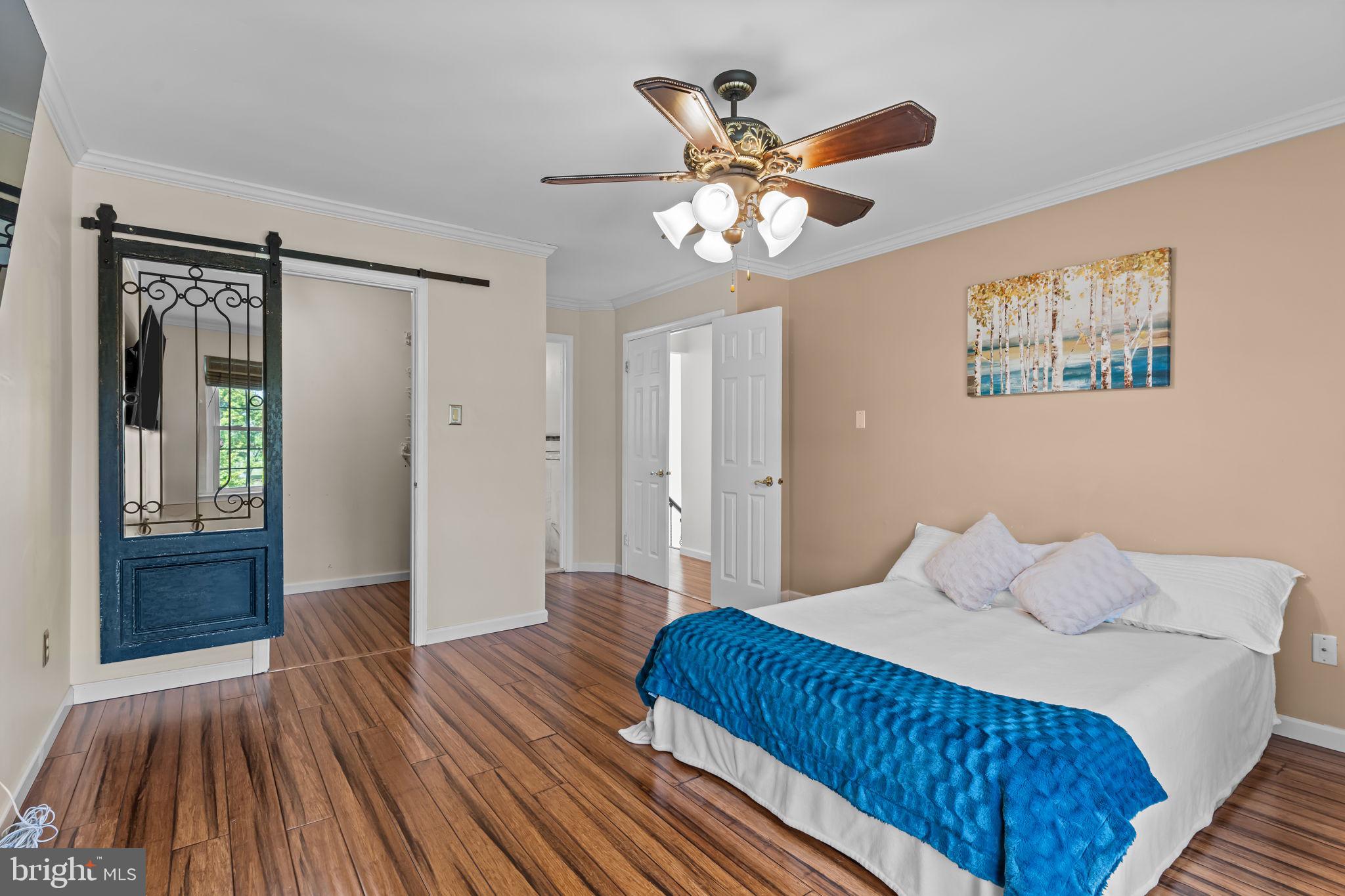 15 East Park Road Newtown, PA 18940 - Photo 19 of 35 a bedroom with a large bed and a chandelier