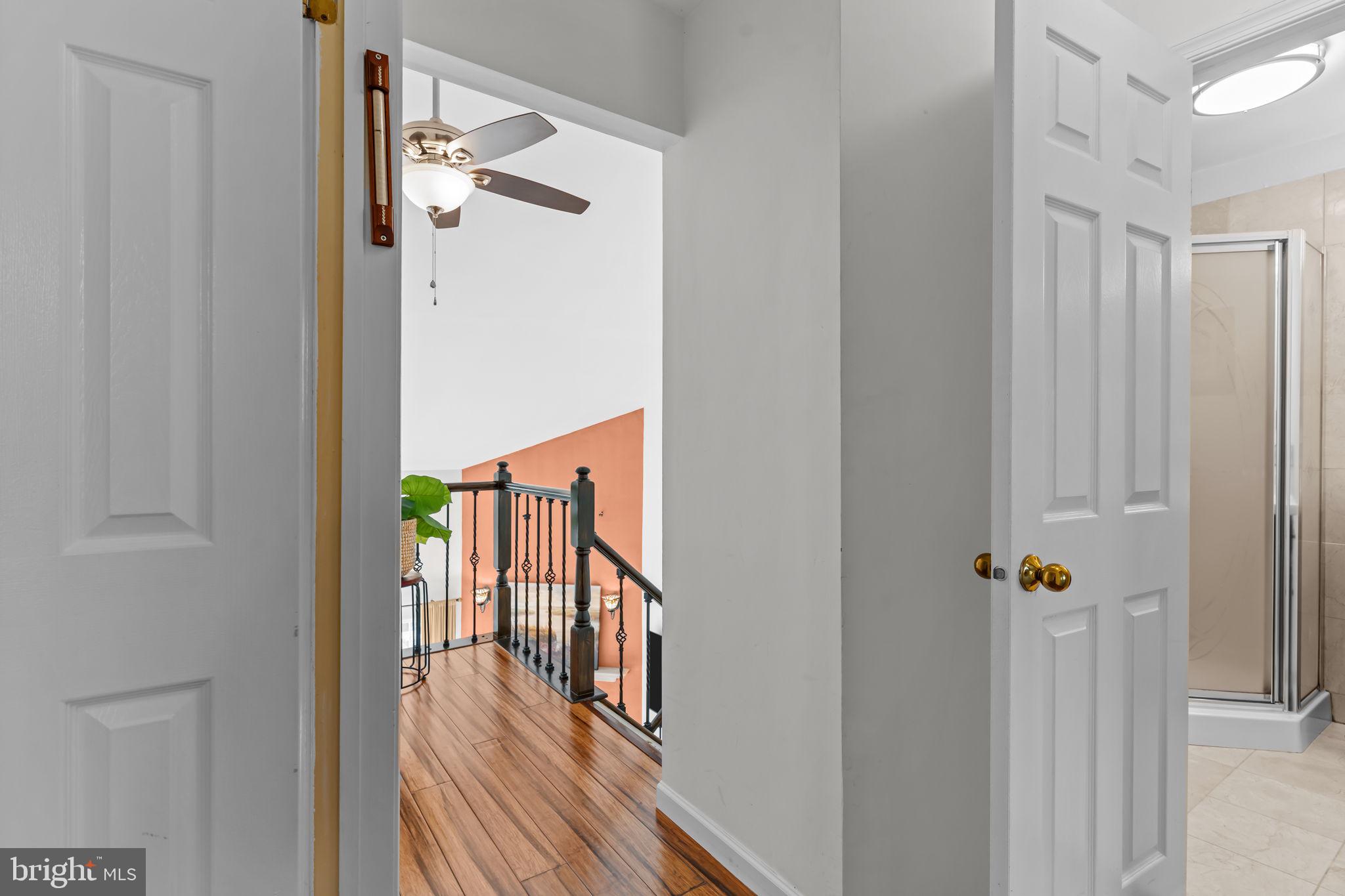 15 East Park Road Newtown, PA 18940 - Photo 23 of 35 a hallway with wooden floor chandelier