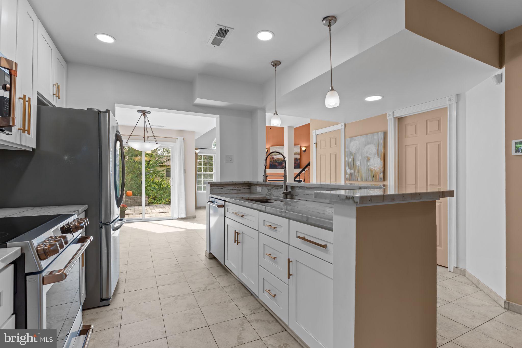 15 East Park Road Newtown, PA 18940 - Photo 4 of 35 a large kitchen with a large window and stainless steel appliances