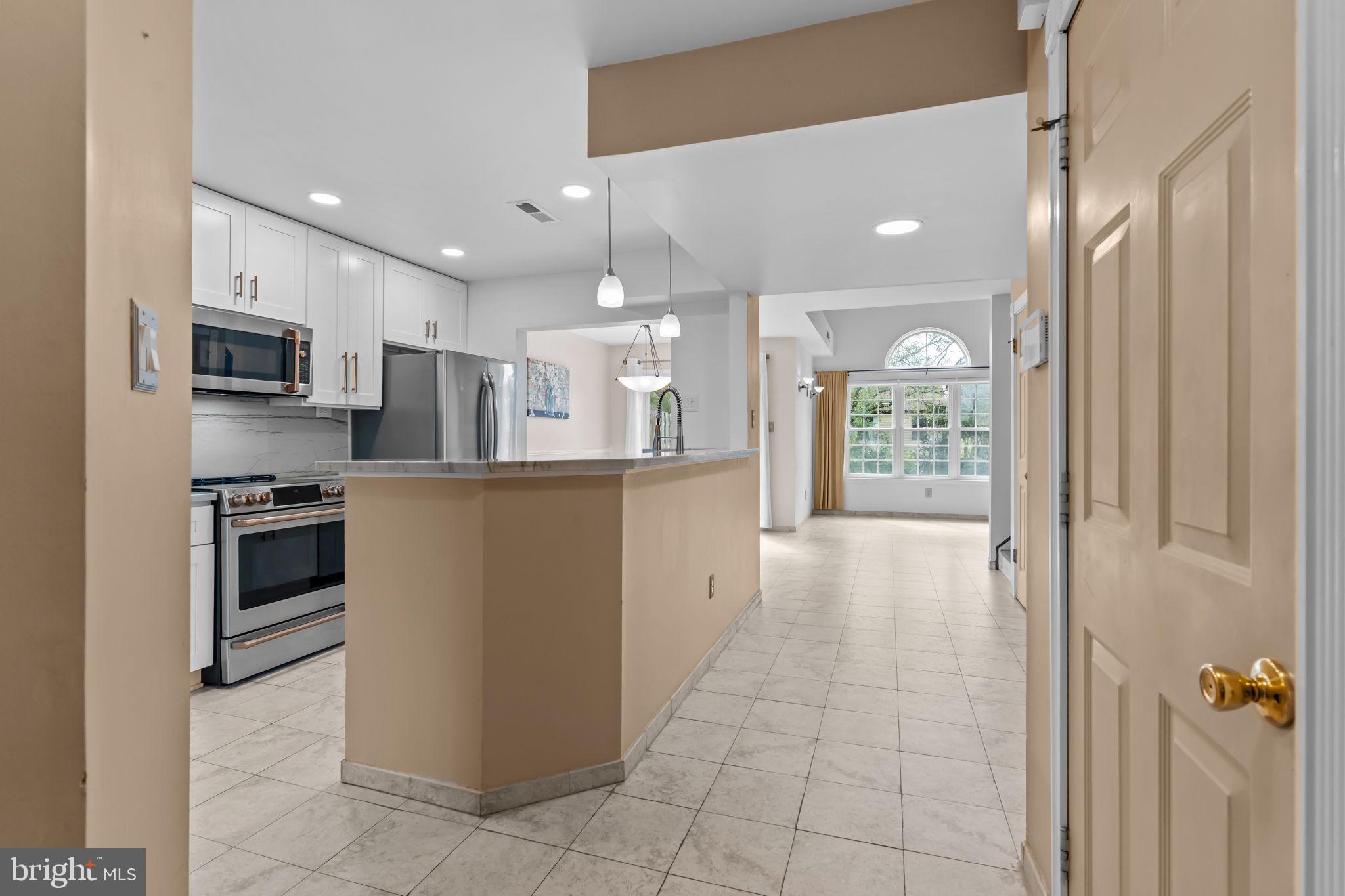 15 East Park Road Newtown, PA 18940 - Photo 8 of 35 a kitchen with stainless steel appliances a refrigerator sink and microwave