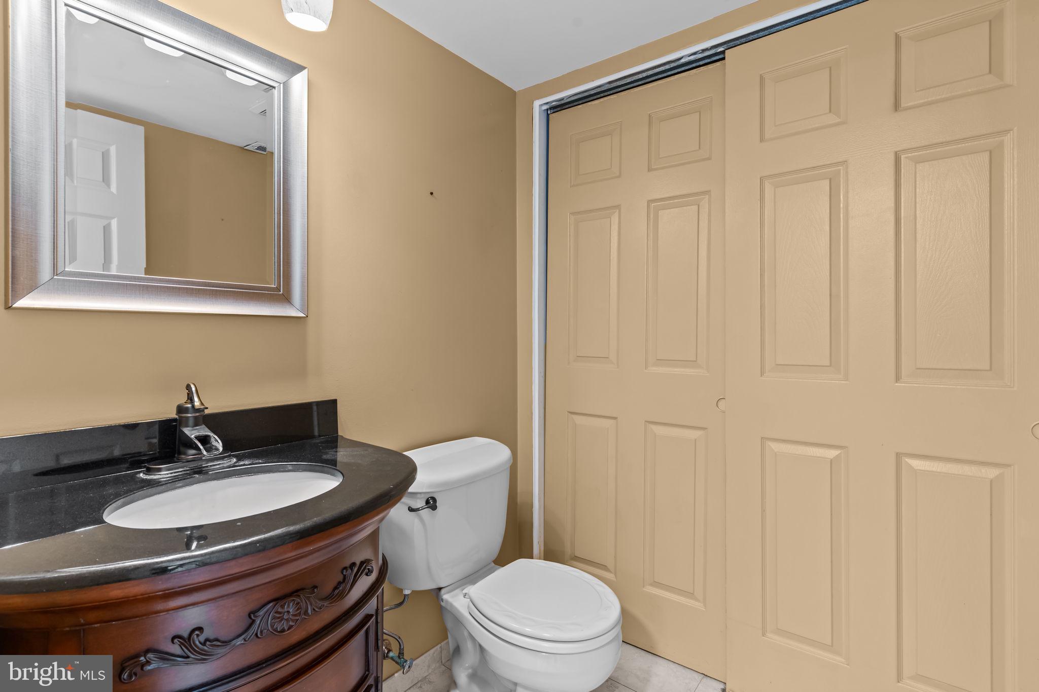 15 East Park Road Newtown, PA 18940 - Photo 9 of 35 a bathroom with a sink a toilet and a mirror