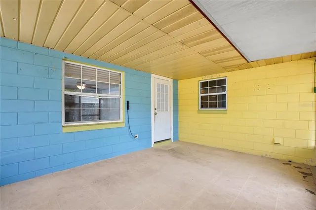 a view of an empty room with a window