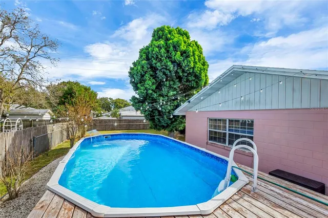 a view of swimming pool with seating space