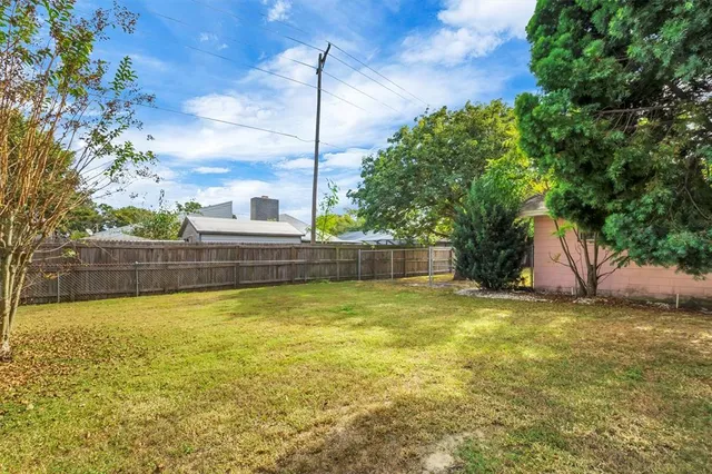 a view of a swimming pool with an outdoor seating