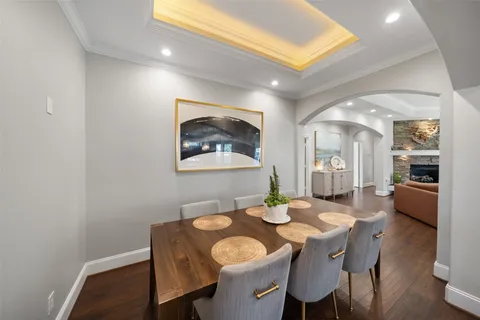 a view of a dining room with furniture and wooden floor