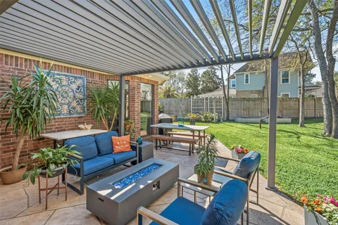 a patio with yard table and chairs