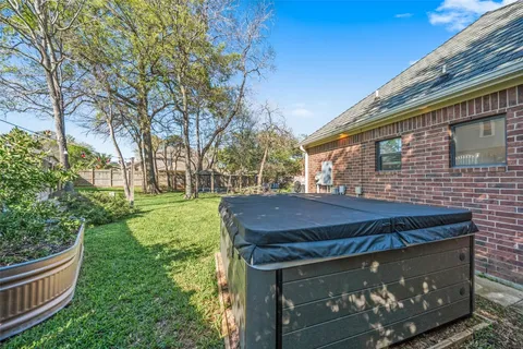 a view of a wooden house with a yard