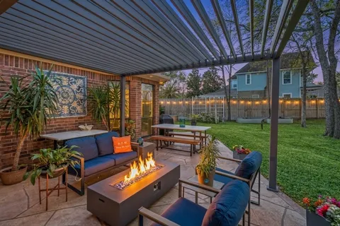 a patio with yard table and chairs