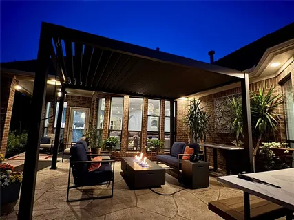 a living room with patio furniture and a flat screen tv