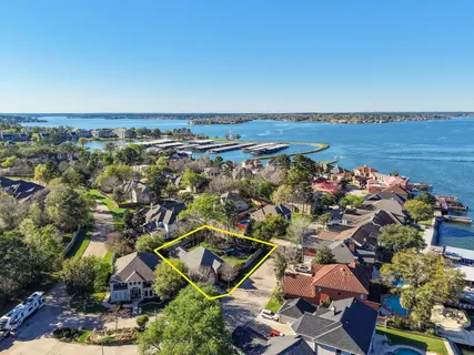 an aerial view of a house with a lake view