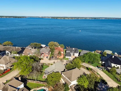 an aerial view of a houses with an outdoor space