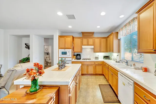 a bathroom with a sink toilet and a mirror