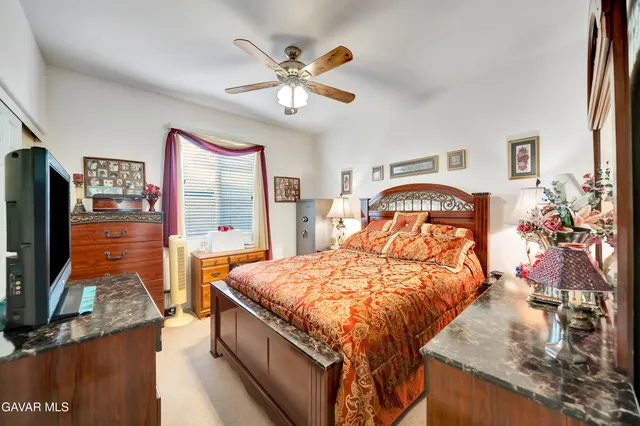 a utility room with cabinets washer and dryer