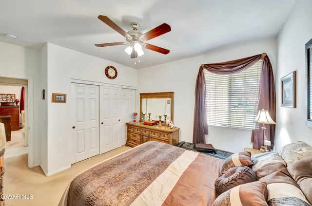 a spacious bathroom with a double vanity sink a mirror and a bathtub