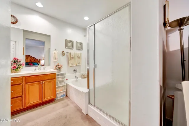 a view of walk in closet with clothes