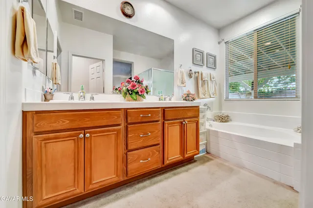 a view of a chairs and table in a patio