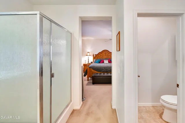 a patio with a table chairs and a barbeque