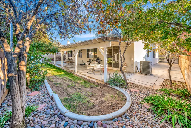 a view of a house with a tree