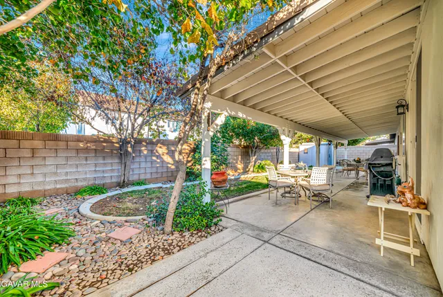 a view of a pathway of a house with a patio