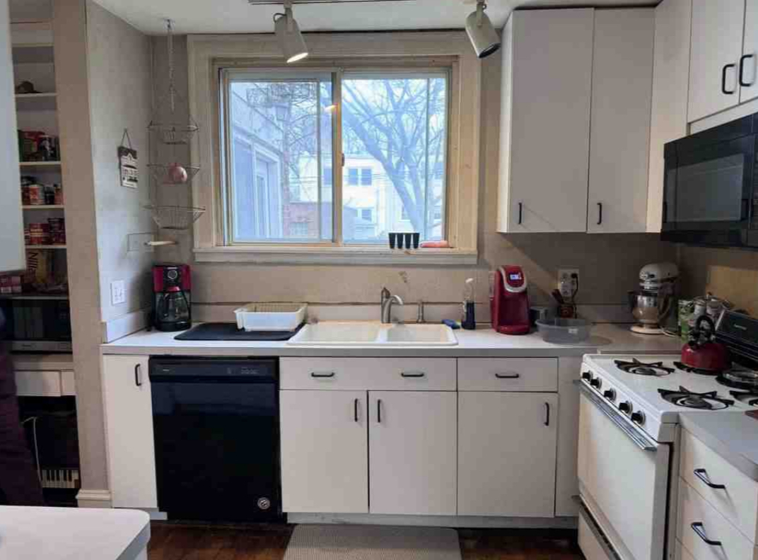 2130 West Farwell Avenue Chicago, IL 60645 - Photo 2 of 14 a kitchen with a sink stove and cabinets