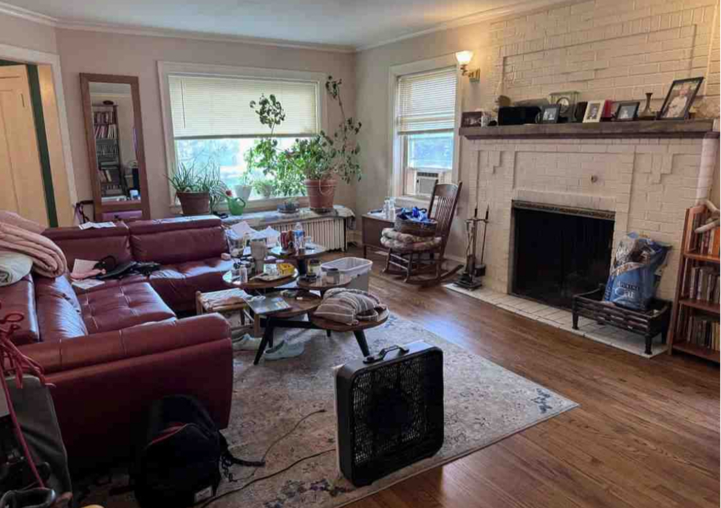 2130 West Farwell Avenue Chicago, IL 60645 - Photo 3 of 14 a living room with furniture and a fireplace