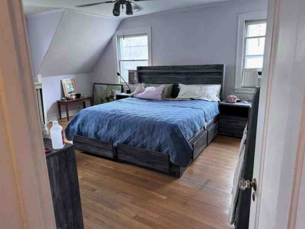 2130 West Farwell Avenue Chicago, IL 60645 - Photo 7 of 14 a bedroom with a bed and window